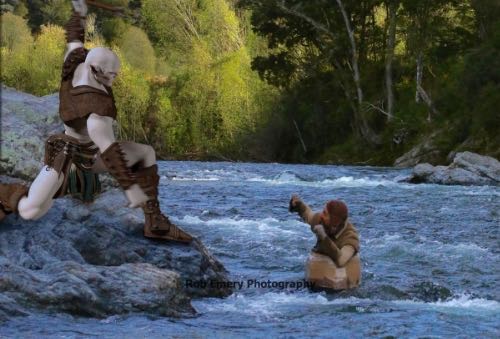 orc on shore attacking bofur in a barrel